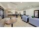 Spacious clubhouse area with tables, chairs, kitchenette, and comfortable seating at 9845 E Edgestone Dr, Scottsdale, AZ 85255