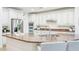 Modern kitchen features a large island with seating, stainless steel appliances, and plenty of counter space at 9845 E Edgestone Dr, Scottsdale, AZ 85255
