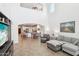 Spacious living room features high ceilings, neutral tones, and an open floor plan to the kitchen at 9845 E Edgestone Dr, Scottsdale, AZ 85255