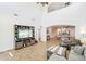Bright, open living room with high ceilings, large windows, and views of the kitchen area at 9845 E Edgestone Dr, Scottsdale, AZ 85255