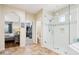 Ensuite bathroom featuring a glass-enclosed shower and access to a walk-in closet at 9845 E Edgestone Dr, Scottsdale, AZ 85255