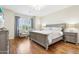 Serene main bedroom with hardwood floors, soft natural light, and elegant furnishings at 9845 E Edgestone Dr, Scottsdale, AZ 85255