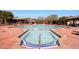 Beautiful community pool with cabanas and sun loungers at 9845 E Edgestone Dr, Scottsdale, AZ 85255