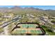 Aerial view of community tennis courts with mountain views at 9845 E Edgestone Dr, Scottsdale, AZ 85255