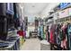 Large, organized walk-in closet with ample shelving, hanging space, and storage solutions at 9845 E Edgestone Dr, Scottsdale, AZ 85255
