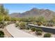 Scenic walking path with desert landscaping and mountain views, great for exercise and enjoying nature at 9845 E Edgestone Dr, Scottsdale, AZ 85255