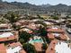Aerial view of a community with a pool and desert mountain views at 10410 N Cave Creek Rd # 2220, Phoenix, AZ 85020