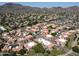 Bird's eye view of community with mature trees, desert landscaping, and mountain views at 10410 N Cave Creek Rd # 2220, Phoenix, AZ 85020
