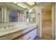Neutral bathroom featuring double sinks, spacious vanity, framed mirrors and tiled shower/tub at 10410 N Cave Creek Rd # 2220, Phoenix, AZ 85020