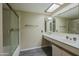 Bright bathroom featuring a shower, vanity with sink, and a skylight at 10410 N Cave Creek Rd # 2220, Phoenix, AZ 85020