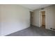 A carpeted bedroom featuring a closet and a window at 10410 N Cave Creek Rd # 2220, Phoenix, AZ 85020