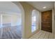 Welcoming foyer with beautiful dark wood door and unique archways leading to other rooms at 10410 N Cave Creek Rd # 2220, Phoenix, AZ 85020