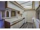 Kitchen with white cabinets and appliances, complemented by a skylight for ample natural light at 10410 N Cave Creek Rd # 2220, Phoenix, AZ 85020