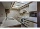 Bright kitchen with white appliances, and plenty of counter and cabinet space at 10410 N Cave Creek Rd # 2220, Phoenix, AZ 85020