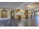 Bright open living area with modern flooring, and views of the kitchen and entryway at 10410 N Cave Creek Rd # 2220, Phoenix, AZ 85020