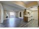 Open-concept layout featuring a kitchen, fireplace, and sliding glass door to the outside at 10410 N Cave Creek Rd # 2220, Phoenix, AZ 85020