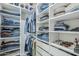 Organized walk-in closet with custom shelving, drawers, and ample storage space at 10509 W Harmony Ln, Peoria, AZ 85382