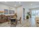 Cozy dining area featuring a glass-top table and stylish decor at 10509 W Harmony Ln, Peoria, AZ 85382