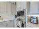 Detailed shot of a modern kitchen with stainless steel appliances and ample cabinet space at 10509 W Harmony Ln, Peoria, AZ 85382