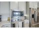 Close-up of a well-equipped kitchen with modern appliances and a clean, functional design at 10509 W Harmony Ln, Peoria, AZ 85382