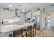 Modern kitchen featuring an island with seating, stainless steel appliances, and pendant lighting at 10509 W Harmony Ln, Peoria, AZ 85382