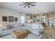 Open-concept living room and kitchen with modern decor, comfortable sofa, and lots of natural light at 10509 W Harmony Ln, Peoria, AZ 85382
