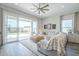 Bright living room with sliding glass doors leading to an outdoor patio and backyard at 10509 W Harmony Ln, Peoria, AZ 85382