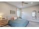 Light-filled primary bedroom with coordinated furniture and tranquil ambiance at 10509 W Harmony Ln, Peoria, AZ 85382