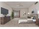 Cozy bedroom with neutral colors, a ceiling fan, and carpeted floors at 10724 W Cheryl Dr, Sun City, AZ 85351