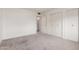 Spacious bedroom with carpeted floors and a double door closet at 10724 W Cheryl Dr, Sun City, AZ 85351