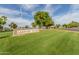 Lakeview Center community entrance with well-maintained lawns and landscaping at 10724 W Cheryl Dr, Sun City, AZ 85351