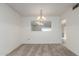 Dining room with lots of light and neutral carpet at 10724 W Cheryl Dr, Sun City, AZ 85351