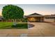 Charming single-story home with well-maintained lawn and covered parking at 10724 W Cheryl Dr, Sun City, AZ 85351
