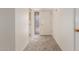Hallway with carpet leads to the front door and offers easy access to living spaces at 10724 W Cheryl Dr, Sun City, AZ 85351