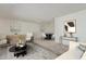 Bright living room featuring neutral decor, plush carpeting, and an open layout at 10724 W Cheryl Dr, Sun City, AZ 85351