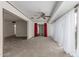 Spacious living room featuring neutral walls, plush carpeting, and natural lighting at 10724 W Cheryl Dr, Sun City, AZ 85351