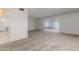 Bright living room with a view into the dining room and the kitchen at 10724 W Cheryl Dr, Sun City, AZ 85351