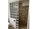 A bathroom featuring tile accents and glass block for natural light at 10827 W Santa Fe Dr, Sun City, AZ 85351