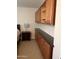 Bedroom featuring cabinets and a dark countertop at 10827 W Santa Fe Dr, Sun City, AZ 85351
