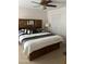 Bedroom featuring a custom headboard with built-in storage at 10827 W Santa Fe Dr, Sun City, AZ 85351