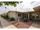 Charming single-story home featuring desert landscaping and a cozy covered entry at 10827 W Santa Fe Dr, Sun City, AZ 85351