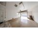 Spacious garage with epoxy floors and an abundance of natural light at 10827 W Santa Fe Dr, Sun City, AZ 85351