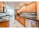 Spacious kitchen with stainless steel appliances and stylish countertops at 10827 W Santa Fe Dr, Sun City, AZ 85351