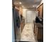 Kitchen features wood cabinets, granite countertops, stainless steel appliances and tile flooring at 10827 W Santa Fe Dr, Sun City, AZ 85351