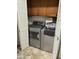 A laundry room is visible featuring a full-sized washer and dryer with folding doors at 10827 W Santa Fe Dr, Sun City, AZ 85351