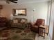 Neutral toned living room, perfect for relaxation and Gathering gatherings at 10827 W Santa Fe Dr, Sun City, AZ 85351