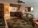 Comfortable living room with tile floors and an open layout to the kitchen at 10827 W Santa Fe Dr, Sun City, AZ 85351