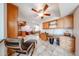 Home office space featuring custom cabinets, desk, and lounge chair with ottoman at 10827 W Santa Fe Dr, Sun City, AZ 85351