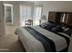 Main bedroom with a view to the ensuite bathroom and bright light at 10827 W Santa Fe Dr, Sun City, AZ 85351