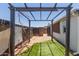 Landscaped backyard with artificial grass, a pergola, and secure fencing at 10951 N 91St Ave # 222, Peoria, AZ 85345